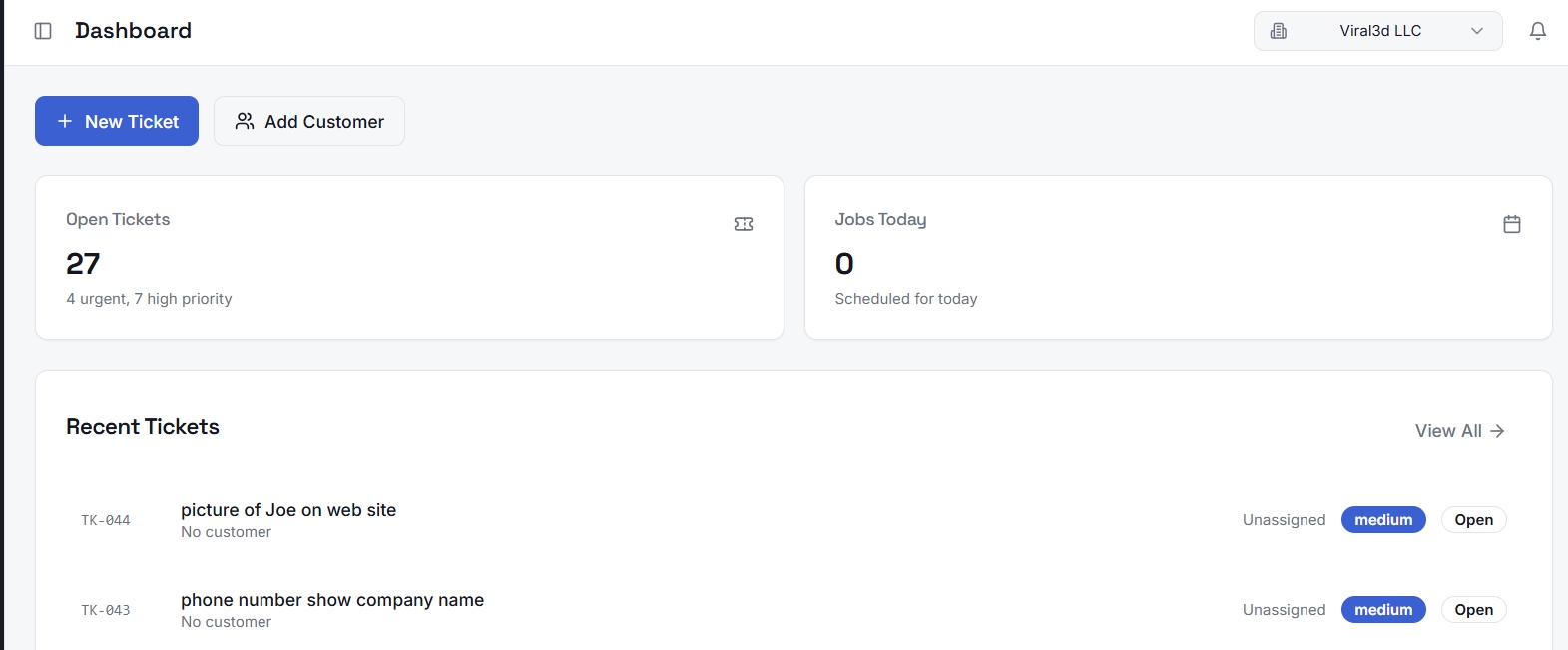 Custom ticketing system dashboard showing open tickets, jobs scheduled today, and a recent tickets list with priority and status.